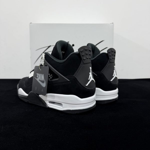 Rear angle view of Jordan 4 White Thunder Reps showing heel structure