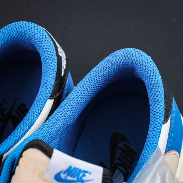 Nike logo tongue on Travis Scott Fragment Design Jordan 1 Low reps with woven tag