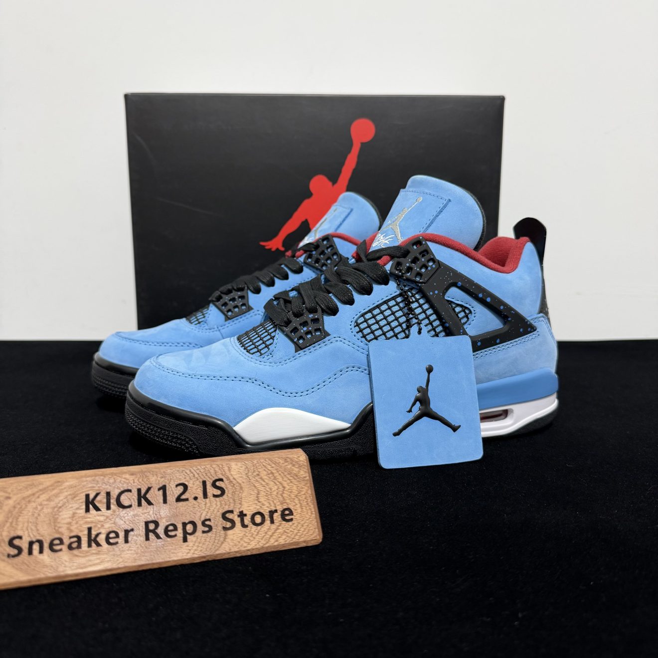 Jordan 4 Travis Scott Reps with box displayed on table