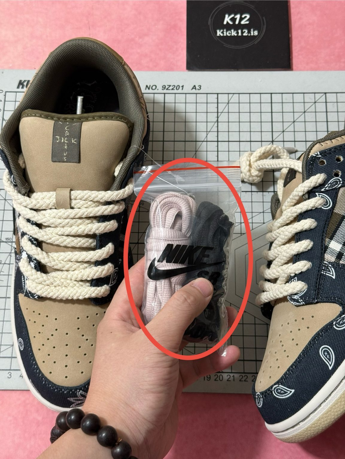 Cactus Jack insole art and extra lace sets included with Travis Scott Dunk reps