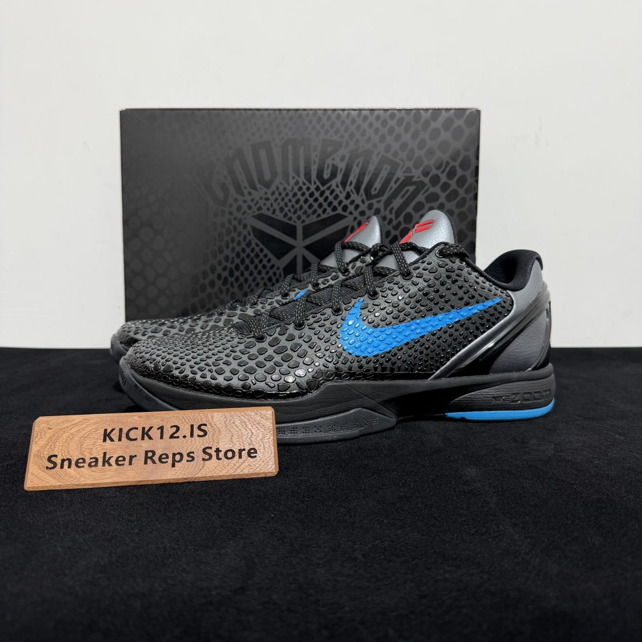 Kobe 6 Dark Knight Reps with box displayed on table