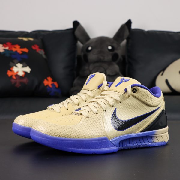 Side view of Kobe 4 Barcelona Reps showing gold upper with red and blue accents