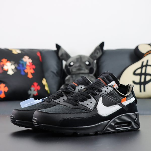 Side view of Off White Air Max 90 Reps showcasing black mesh and leather upper with 