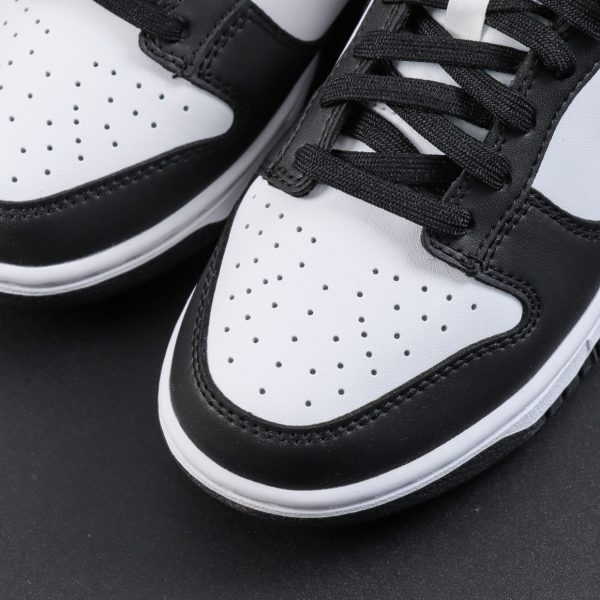 Close-up of toebox on Panda Dunk reps in black and white