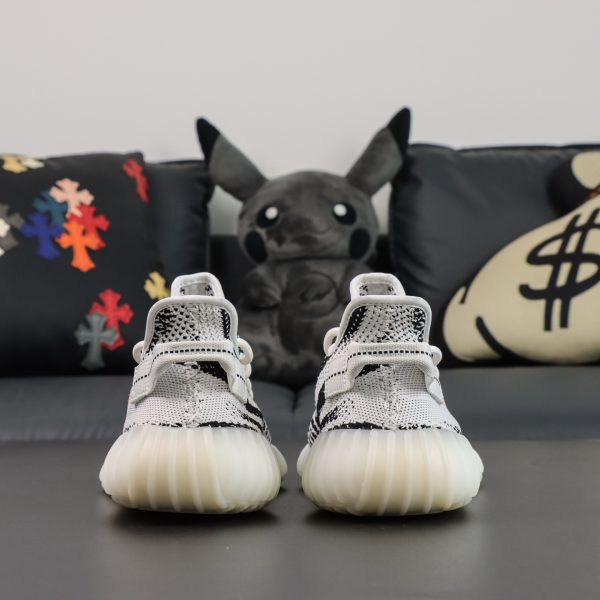 Back heel view of Yeezy 350 Zebra reps showing striped Primeknit finish