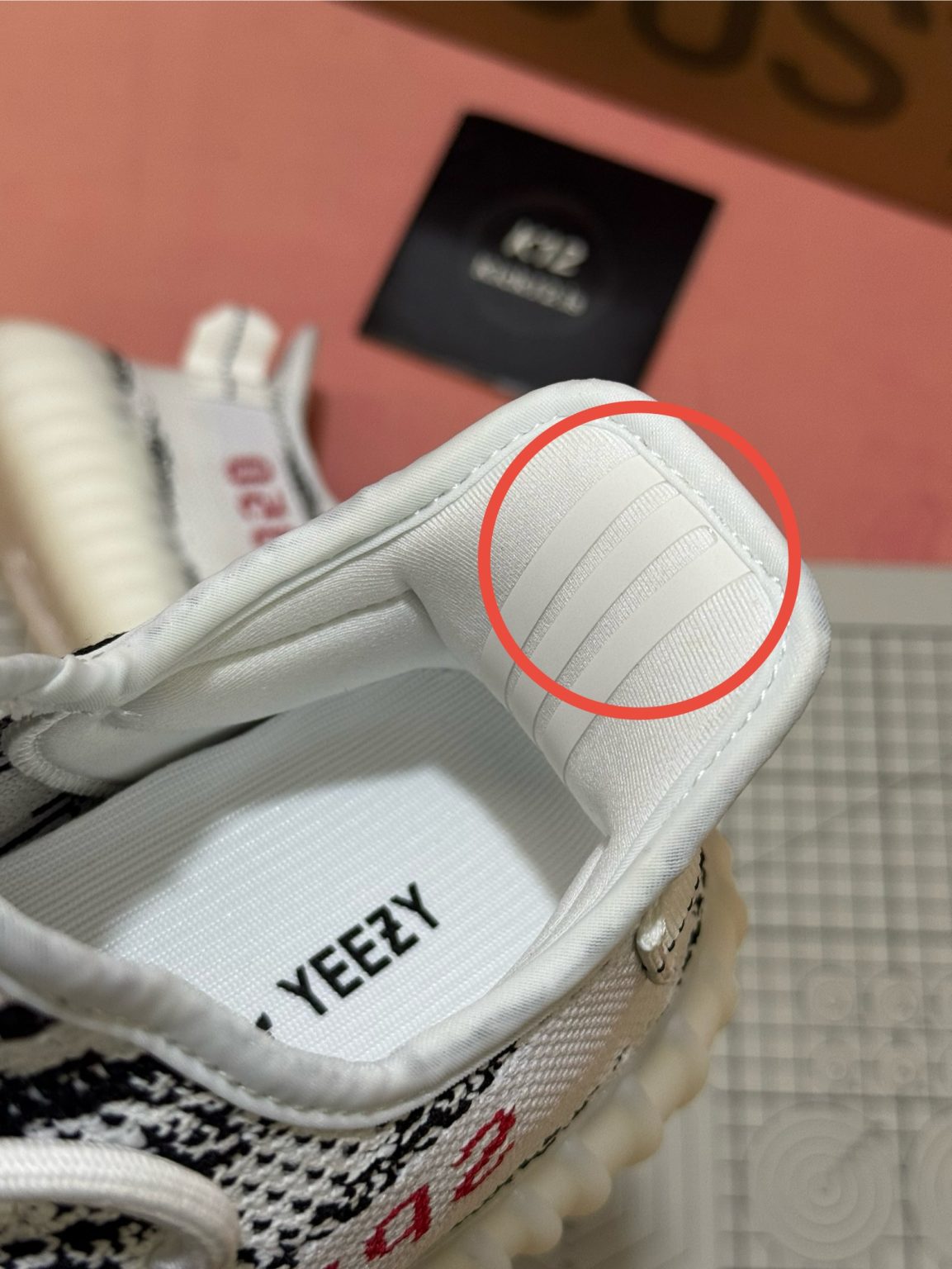 3M reflective heel tab on Yeezy 350 Zebra reps for enhanced visibility and detail accuracy