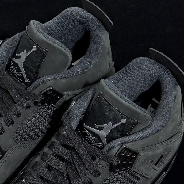 Tongue logo detail on Air Jordan 4 Black Cat Reps 2025